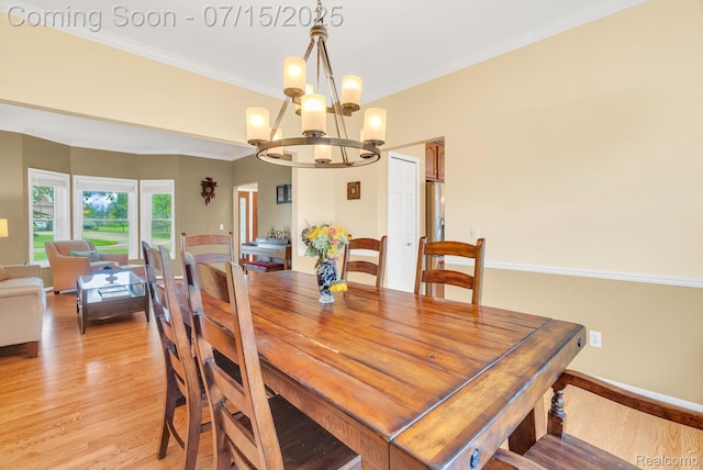 11656 Kings Colony, Grand Blanc, MI 48439 - dining area featuring a chandelier, light wood-style floors, and crown molding
