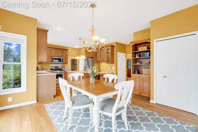 11656 Kings Colony, Grand Blanc, MI 48439 - dining space with a chandelier, light wood finished floors, and recessed lighting