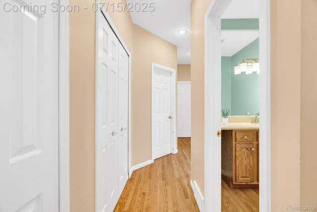 11656 Kings Colony, Grand Blanc, MI 48439 - hall featuring light wood-type flooring and baseboards