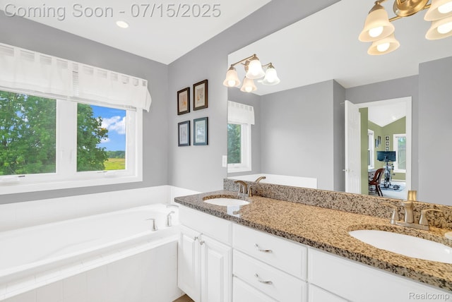 11656 Kings Colony, Grand Blanc, MI 48439 - full bath with a garden tub, double vanity, and a chandelier