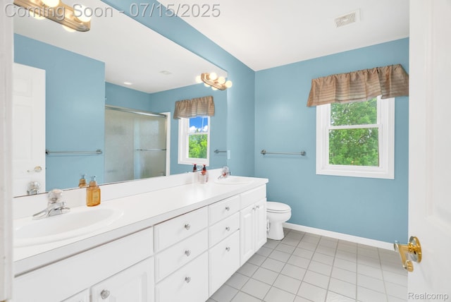 11656 Kings Colony, Grand Blanc, MI 48439 - full bathroom with double vanity, a shower stall, healthy amount of natural light, and tile patterned flooring
