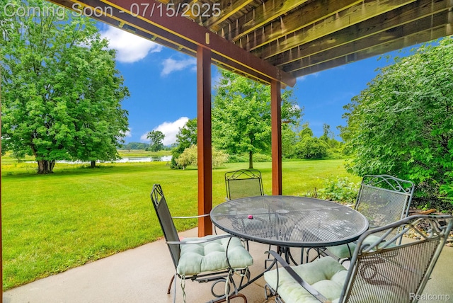 11656 Kings Colony, Grand Blanc, MI 48439 - view of patio with a water view, outdoor dining space, and view of scattered trees