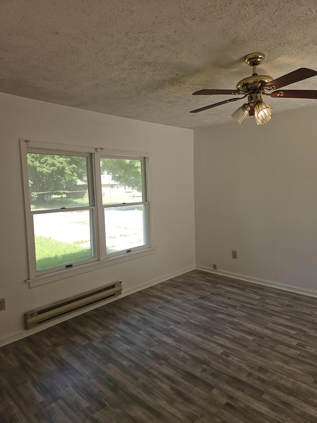 3521 Henderson Rd, Spring Arbor, MI 49283 - empty room with a baseboard heating unit, a textured ceiling, dark wood-style flooring, and a ceiling fan