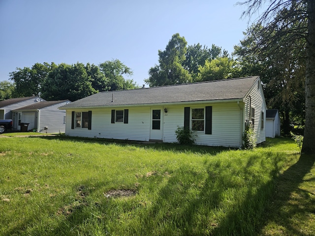 3521 Henderson Rd, Spring Arbor, MI 49283 - ranch-style house with a front lawn and a garage