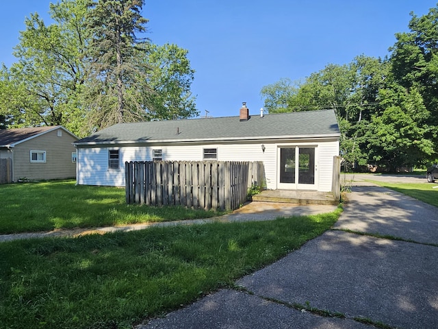 3521 Henderson Rd, Spring Arbor, MI 49283 - rear view of property with a chimney and driveway