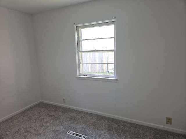 3521 Henderson Rd, Spring Arbor, MI 49283 - spare room with dark colored carpet and baseboards