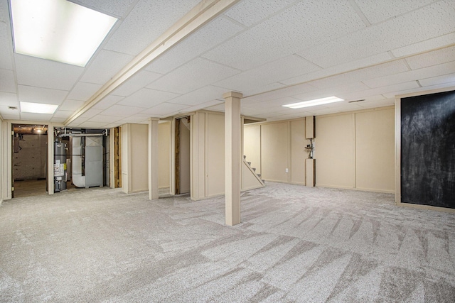 275 W State St, Coldwater, MI 49036 - finished basement with carpet floors, stairway, water heater, a drop ceiling, and heating unit