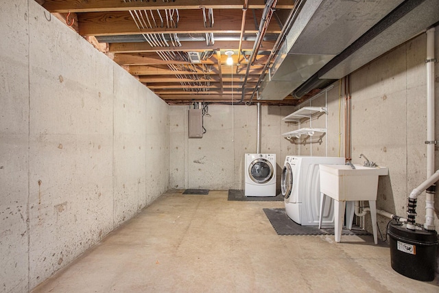 275 W State St, Coldwater, MI 49036 - unfinished below grade area featuring separate washer and dryer and a sink