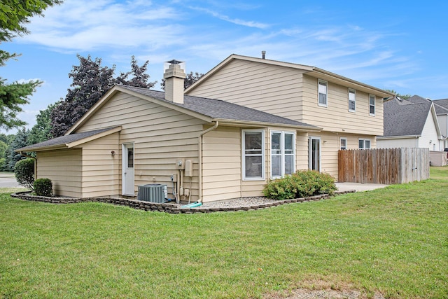 275 W State St, Coldwater, MI 49036 - back of house with a chimney and a shingled roof