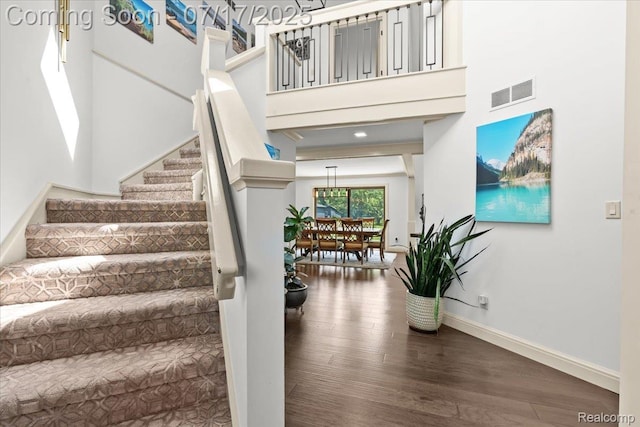 61353 W 8 Mile Rd, South Lyon, MI 48178 - stairs featuring wood finished floors and a high ceiling
