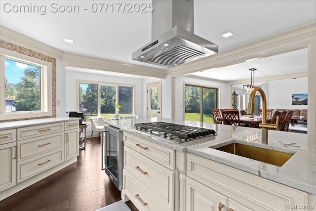 61353 W 8 Mile Rd, South Lyon, MI 48178 - kitchen with island range hood, light stone counters, plenty of natural light, and dark wood-type flooring