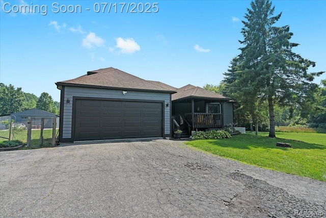 61353 W 8 Mile Rd, South Lyon, MI 48178 - ranch-style house featuring driveway, a front lawn, a garage, and roof with shingles