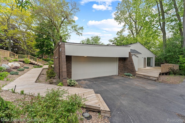 4355 Middleton Dr, Bloomfield Hills, MI 48302 - garage featuring asphalt driveway