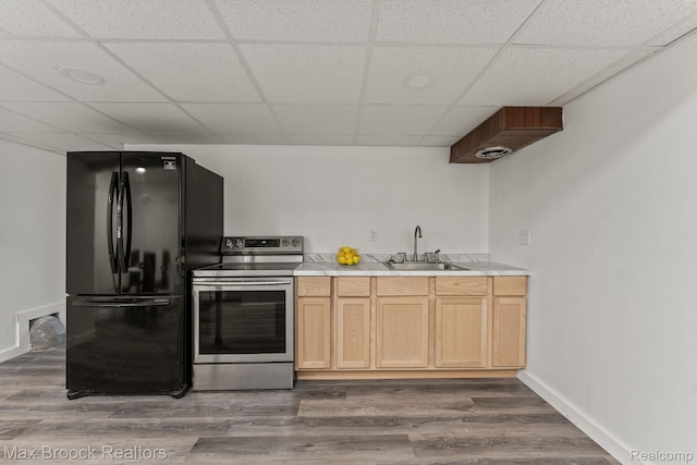 4355 Middleton Dr, Bloomfield Hills, MI 48302 - kitchen featuring stainless steel range with electric cooktop, freestanding refrigerator, a paneled ceiling, light countertops, and wood finished floors