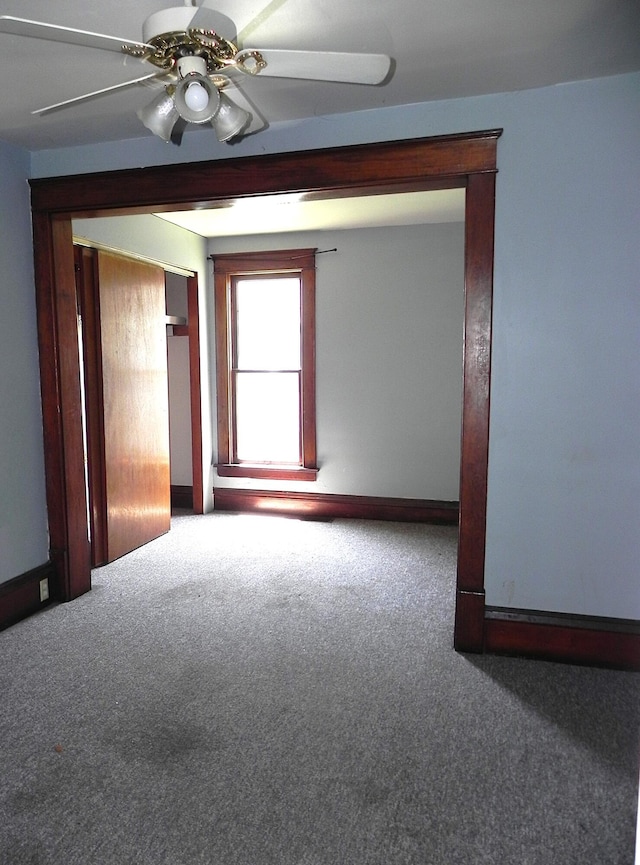 1111 S Main St, Three Rivers, MI 49093 - carpeted empty room featuring a ceiling fan and baseboards