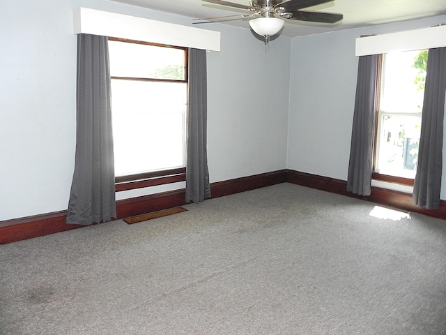 1111 S Main St, Three Rivers, MI 49093 - carpeted empty room featuring a ceiling fan and baseboards