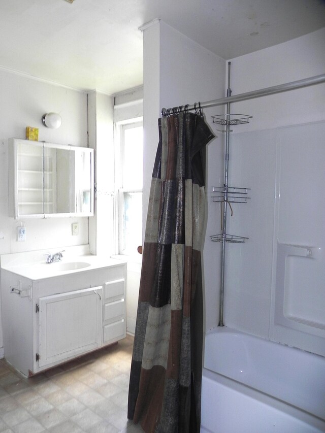 1111 S Main St, Three Rivers, MI 49093 - full bathroom featuring vanity, shower / bathtub combination with curtain, and tile patterned floors