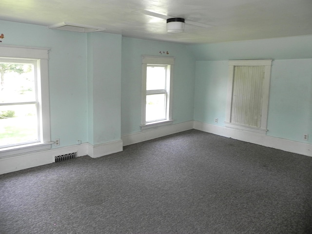 1111 S Main St, Three Rivers, MI 49093 - spare room with dark colored carpet and baseboards