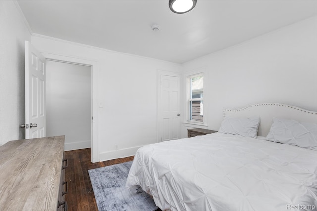 3921 Three Mile Dr, Detroit, MI 48224 - bedroom with dark wood-style flooring and crown molding