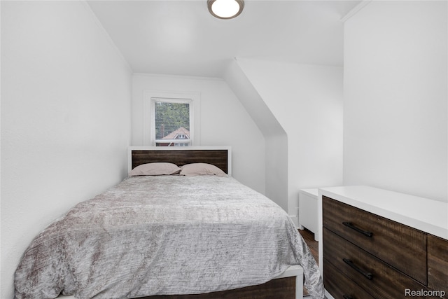 3921 Three Mile Dr, Detroit, MI 48224 - bedroom with dark wood-style flooring
