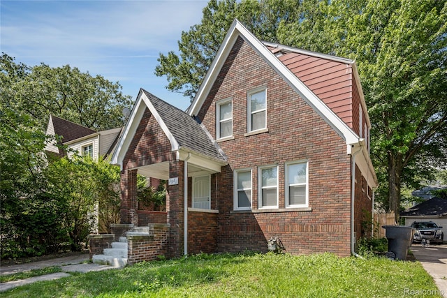 3921 Three Mile Dr, Detroit, MI 48224 - bungalow-style home featuring brick siding