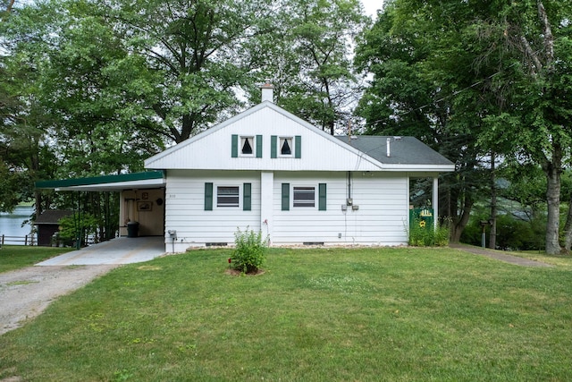 3110 13 Mile Rd, Remus, MI 49340 - view of front of property with driveway, a front yard, a chimney, and a carport