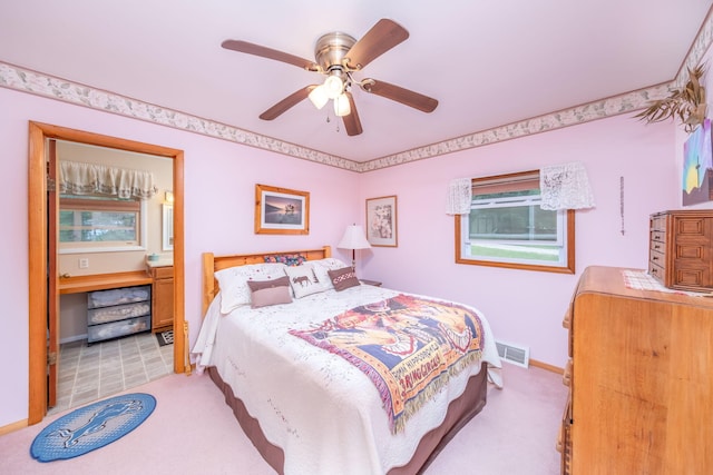 3110 13 Mile Rd, Remus, MI 49340 - bedroom featuring light carpet, connected bathroom, and a ceiling fan