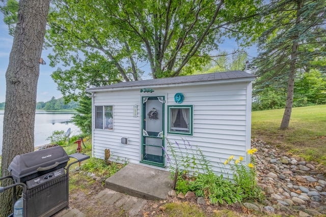 3110 13 Mile Rd, Remus, MI 49340 - view of front of home with an outbuilding and a water view