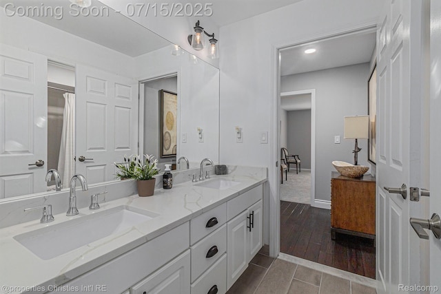 23331 Sawgrass Ct S, South Lyon, MI 48178 - full bath featuring double vanity, wood finished floors, and recessed lighting