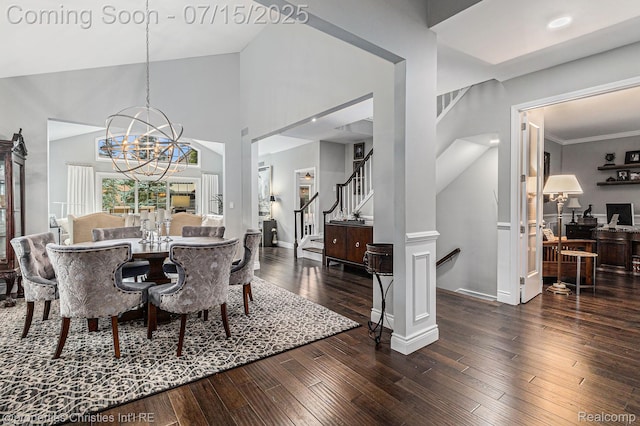 23331 Sawgrass Ct S, South Lyon, MI 48178 - dining room featuring stairs, hardwood / wood-style floors, a chandelier, and high vaulted ceiling