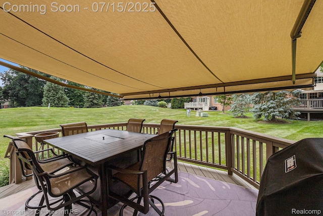 23331 Sawgrass Ct S, South Lyon, MI 48178 - wooden deck featuring a yard, outdoor dining area, and a grill