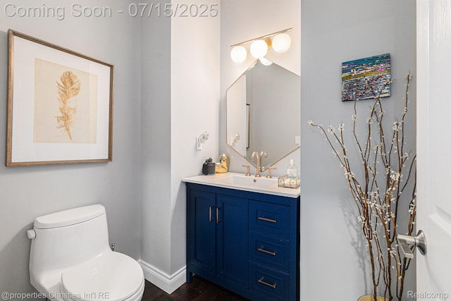 23331 Sawgrass Ct S, South Lyon, MI 48178 - bathroom featuring vanity and wood finished floors