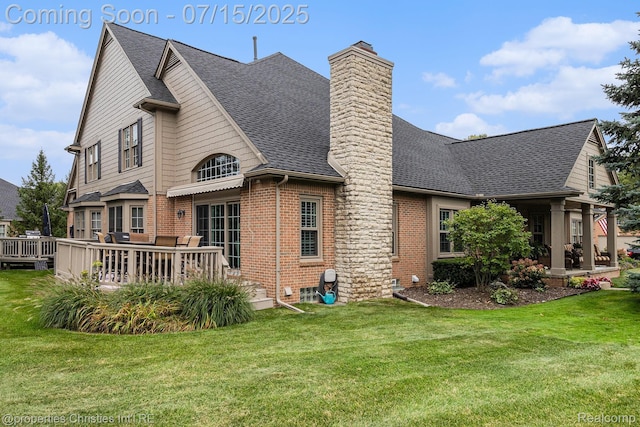 23331 Sawgrass Ct S, South Lyon, MI 48178 - rear view of house featuring brick siding, a chimney, a lawn, roof with shingles, and a deck
