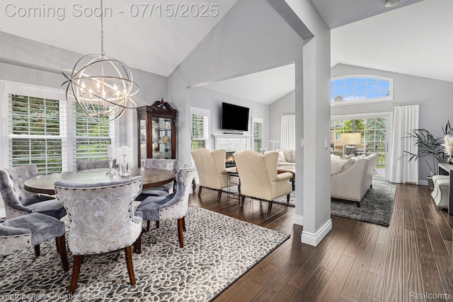 23331 Sawgrass Ct S, South Lyon, MI 48178 - dining space with a chandelier, dark wood-type flooring, and high vaulted ceiling