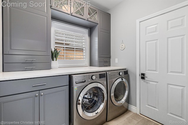 23331 Sawgrass Ct S, South Lyon, MI 48178 - laundry area featuring cabinet space, washer and dryer, and light wood-type flooring