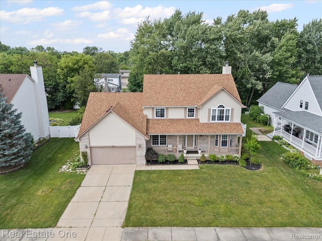 415 Evaline Dr, Troy, MI 48085 - view of front facade featuring covered porch, driveway, an attached garage, and brick siding