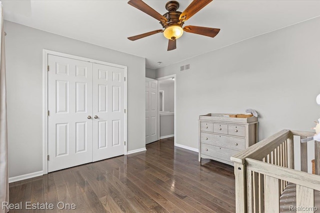 415 Evaline Dr, Troy, MI 48085 - bedroom featuring wood finished floors, a closet, a nursery area, and ceiling fan