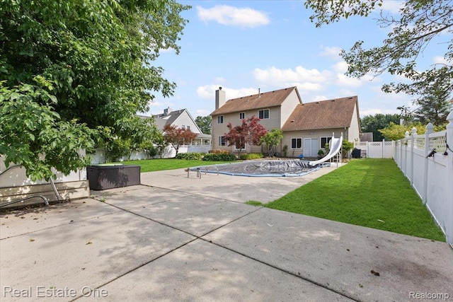 415 Evaline Dr, Troy, MI 48085 - rear view of house featuring a patio and a fenced backyard