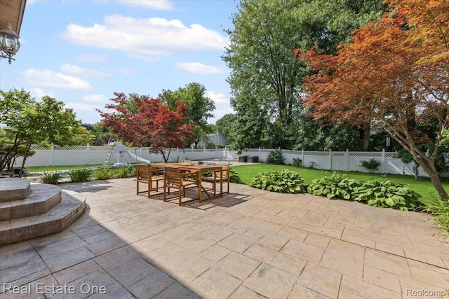 415 Evaline Dr, Troy, MI 48085 - fenced backyard with outdoor dining space and a patio area