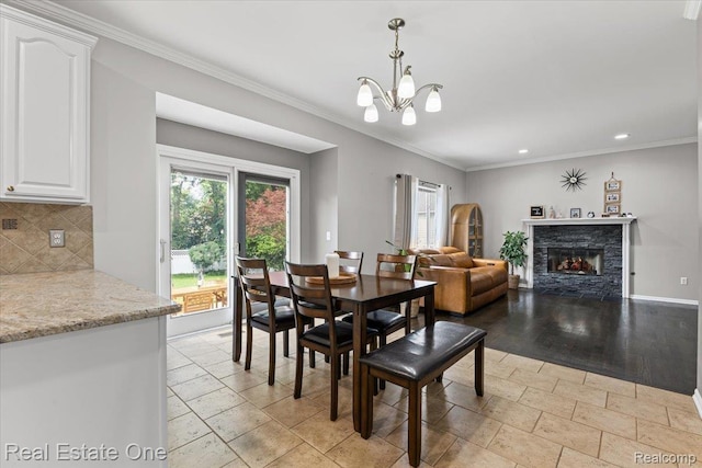 415 Evaline Dr, Troy, MI 48085 - dining space with recessed lighting, a chandelier, crown molding, and a fireplace