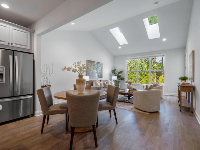 3064 N Spurway Dr, Ann Arbor, MI 48105 - dining room with a skylight, wood finished floors, vaulted ceiling, and recessed lighting