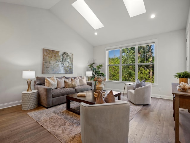 3064 N Spurway Dr, Ann Arbor, MI 48105 - living area featuring a skylight, wood finished floors, recessed lighting, and high vaulted ceiling