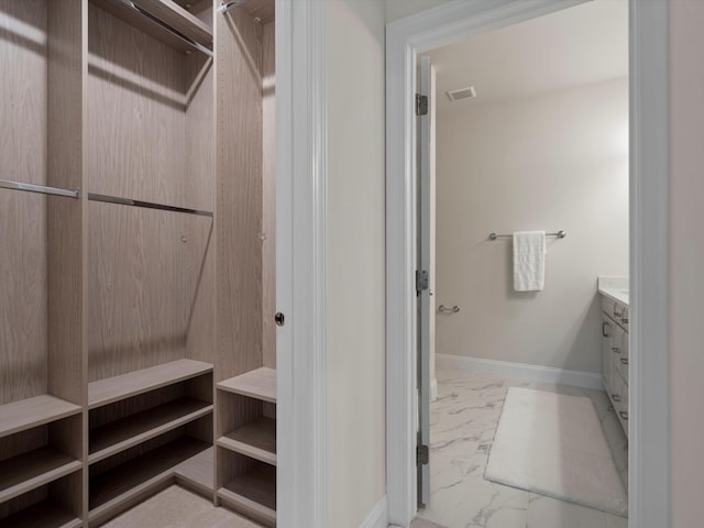 3064 N Spurway Dr, Ann Arbor, MI 48105 - spacious closet featuring marble look tiles
