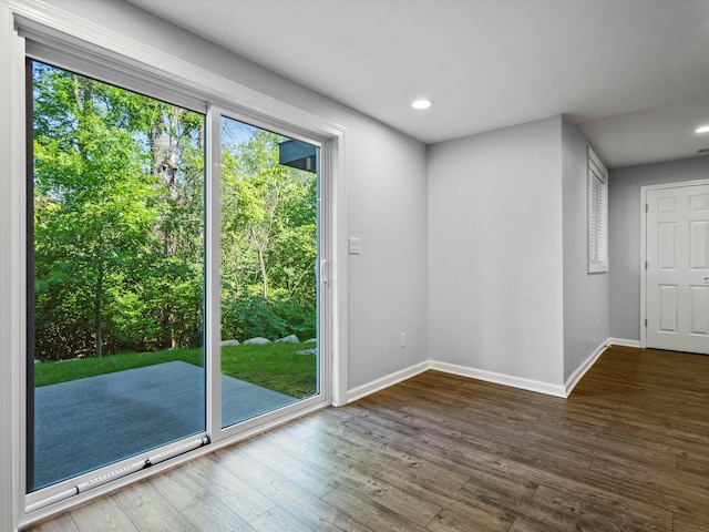3064 N Spurway Dr, Ann Arbor, MI 48105 - doorway to outside with wood finished floors and recessed lighting