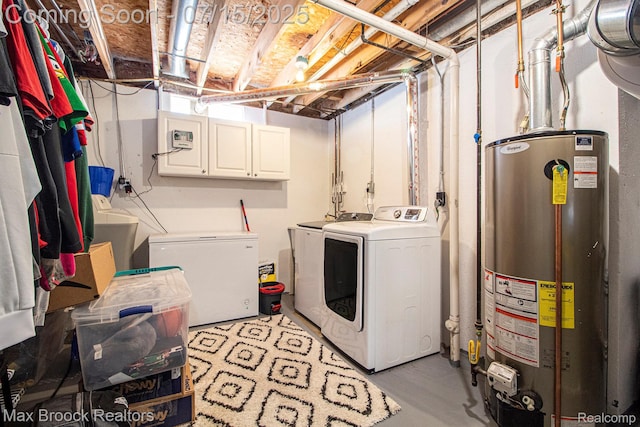 761 Stoney Dr, South Lyon, MI 48178 - laundry area featuring washer and clothes dryer, cabinet space, and water heater