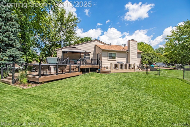 761 Stoney Dr, South Lyon, MI 48178 - back of property with a wooden deck and a chimney