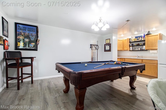 761 Stoney Dr, South Lyon, MI 48178 - playroom featuring billiards, light wood-type flooring, and a chandelier
