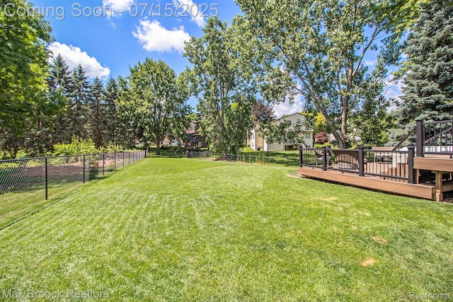 761 Stoney Dr, South Lyon, MI 48178 - view of yard featuring a wooden deck