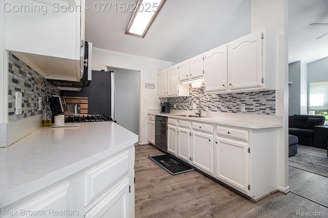 761 Stoney Dr, South Lyon, MI 48178 - kitchen featuring dishwasher, backsplash, white cabinets, light countertops, and wood finished floors