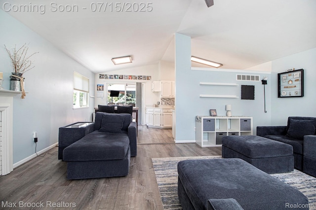 761 Stoney Dr, South Lyon, MI 48178 - living room with lofted ceiling and wood finished floors
